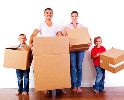 Boxes and furniture being unloaded at a new Finsbury Park home