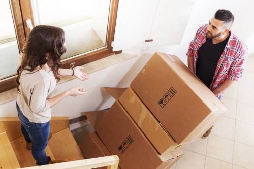Cardboard, metal, and household items being separated for recycling in North London
