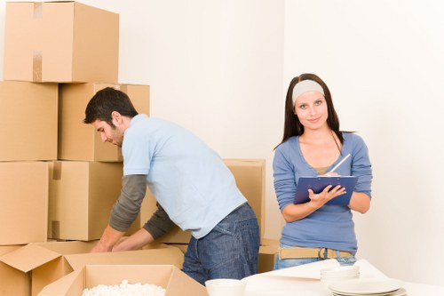 Organised moving boxes and labelled items for a commercial relocation