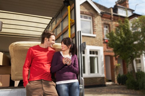 Loading furniture into a van on a residential North London street